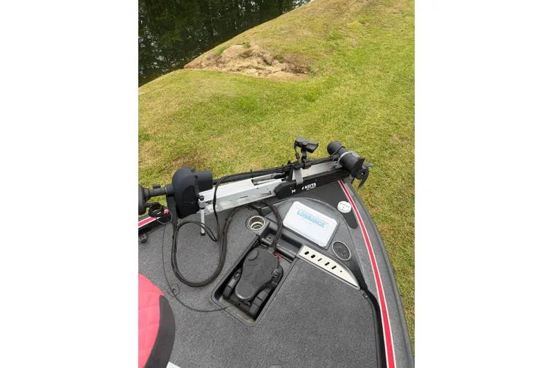 Slide: The Image of 2022 Triton 18 TrX boat deck with trolling motor and Lowrance fish finder. - 8