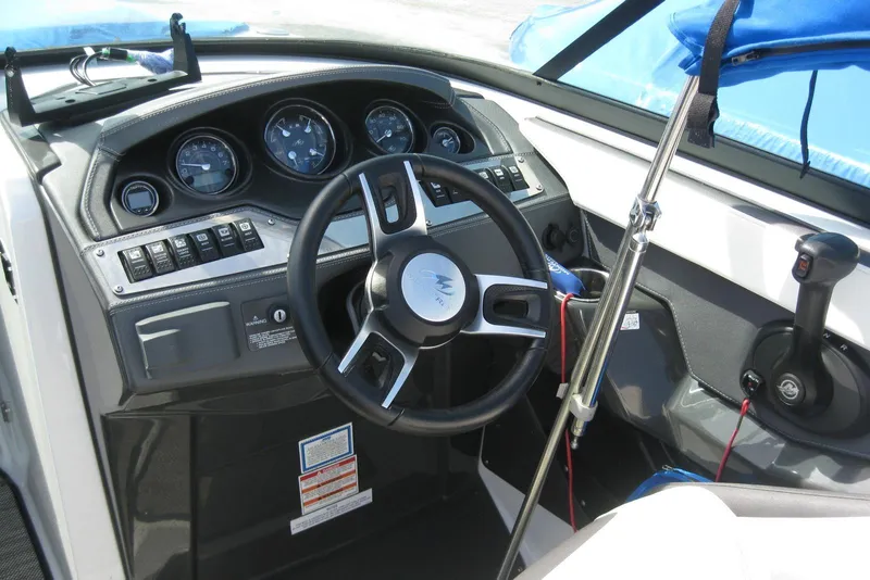 Slide: The Image of 2018 Monterey 278SS Super Sport boat dashboard with steering wheel and control panel. - 14