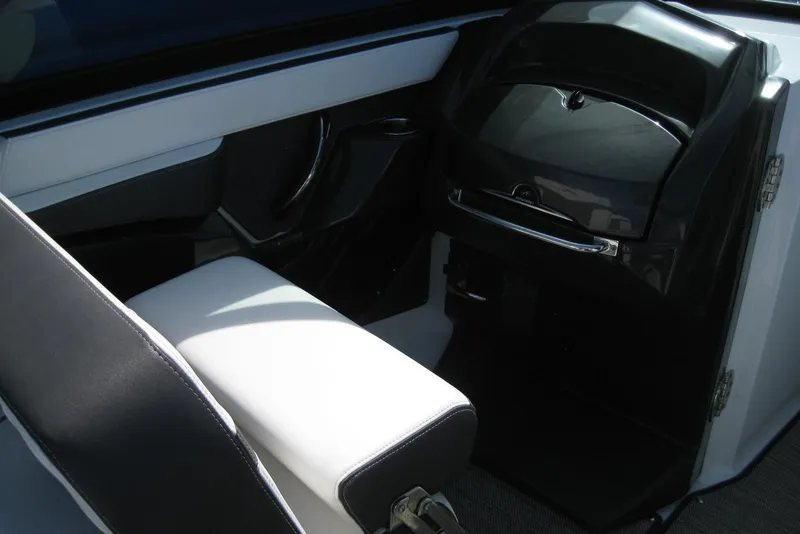 Slide: The Image of Interior of a 2018 Monterey 278SS Super Sport boat, featuring sleek seating and dashboard design. - 16