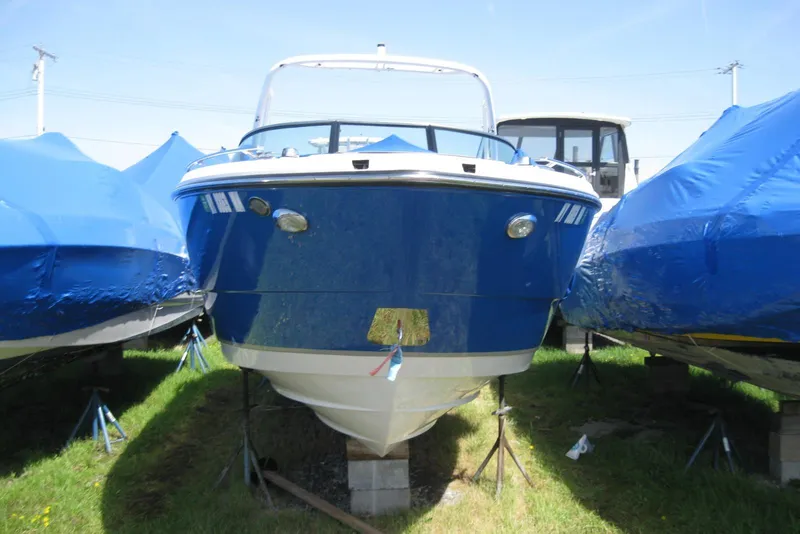 Slide: The Image of 2018 Monterey 278SS Super Sport boat on stands, surrounded by blue covers. - 3