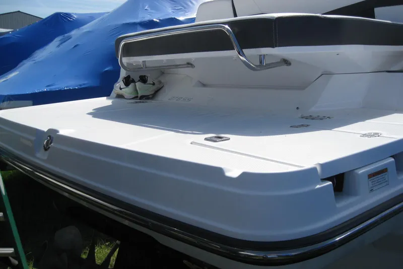 Slide: The Image of 2018 Monterey 278SS Super Sport boat with swim platform and sneakers on deck. - 5
