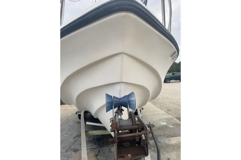 Slide: The Image of 1997 Henry O 199 boat on trailer, showing hull and winch system. - 11