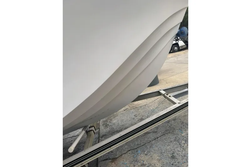 Slide: The Image of Close-up of a 1997 Henry O 199 boat hull on a trailer. - 12