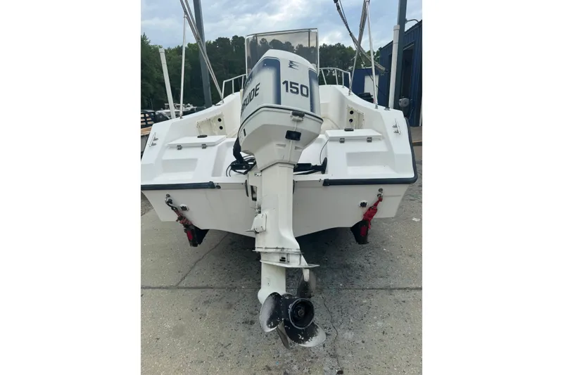 Slide: The Image of Rear view of a 1997 Henry O 199 boat with an Evinrude 150 outboard motor. - 3