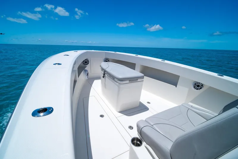 Slide: The Image of 2025 SeaVee 322Z boat interior with seating, ocean view, and clear blue sky. - 13