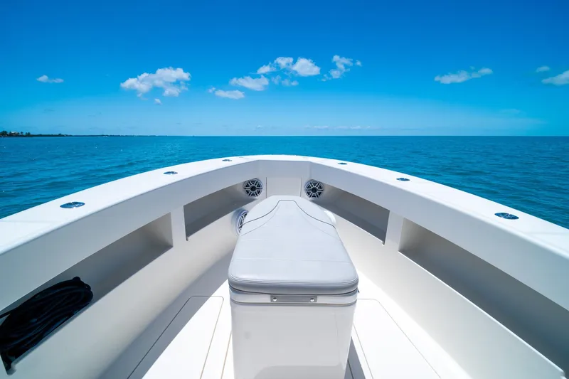 Slide: The Image of 2025 SeaVee 322Z boat on open ocean under clear blue sky. - 14