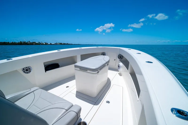 Slide: The Image of 2025 SeaVee 322Z boat interior with seating, ocean view, and clear blue sky. - 15