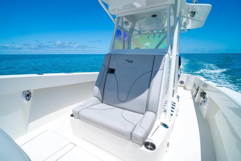 Slide: The Image of 2025 SeaVee 322Z boat interior with sleek seating on open ocean. - 16