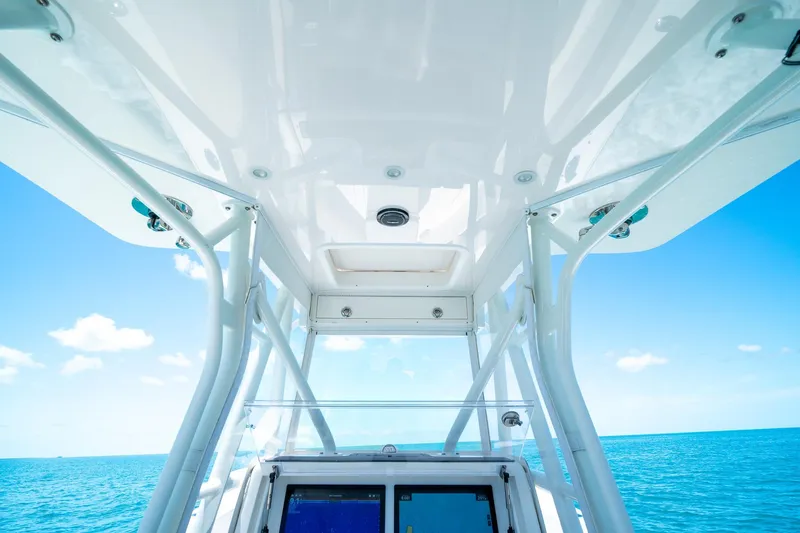 Slide: The Image of 2025 SeaVee 322Z boat interior with ocean view, showcasing sleek design and clear skies. - 22