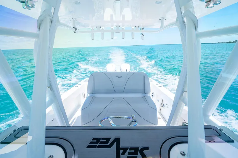 Slide: The Image of 2025 SeaVee 322Z boat cruising on clear blue ocean waters. - 26