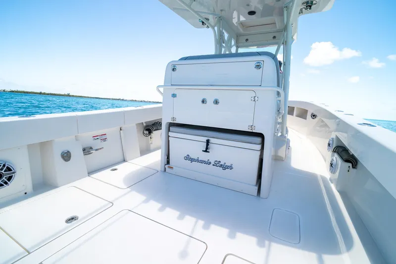 Slide: The Image of 2025 SeaVee 322Z boat interior with storage and seating, on a sunny day at sea. - 29