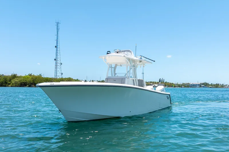 Slide: The Image of 2025 SeaVee 322Z boat on clear blue water under a sunny sky. - 3