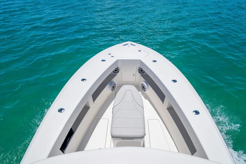 Slide: The Image of Bow view of 2025 SeaVee 322Z boat on clear blue water. - 38