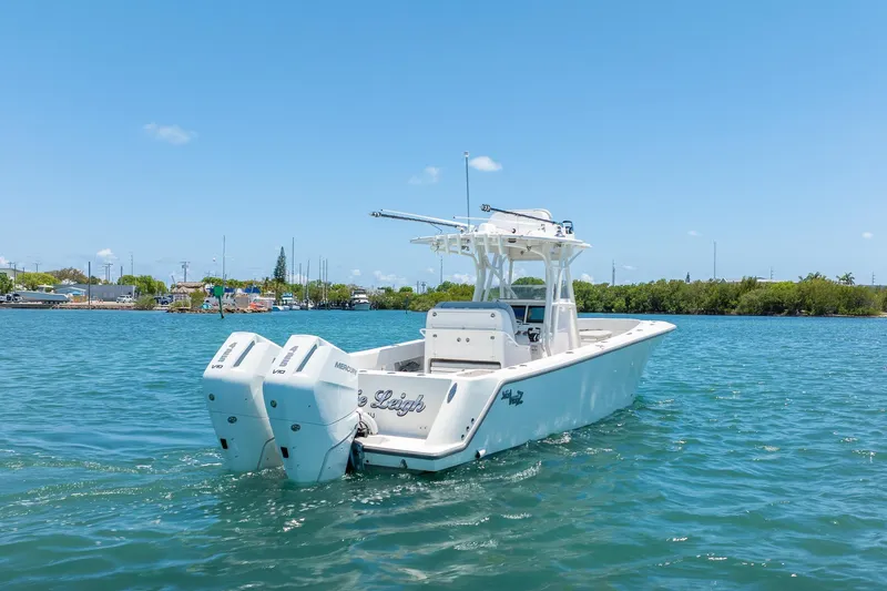 Slide: The Image of 2025 SeaVee 322Z boat with twin Mercury engines on a sunny day. - 5