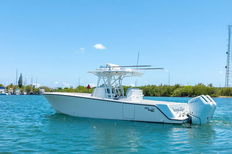 Slide: The Image of 2025 SeaVee 322Z boat on clear blue water under a sunny sky. - 6