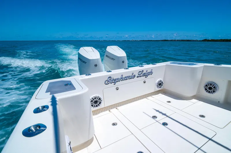 Slide: The Image of 2025 SeaVee 322Z boat cruising on blue ocean with twin Mercury engines. - 7
