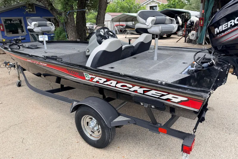 The Image of 2017 Tracker Pro Team 175 TXW fishing boat on trailer, featuring Mercury engine. - 1
