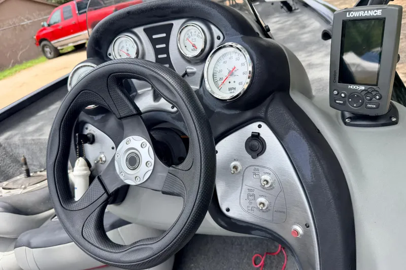 Slide: The Image of 2017 Tracker Pro Team 175 TXW boat dashboard with steering wheel and Lowrance fish finder. - 4
