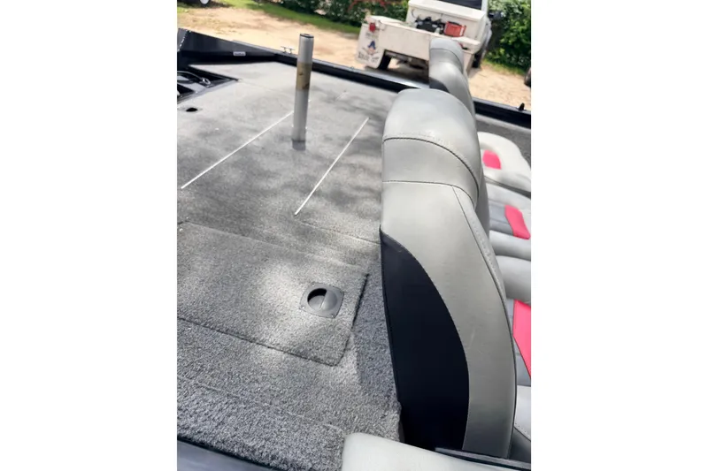 Slide: The Image of 2017 Tracker Pro Team 175 TXW boat interior with gray and red seating. - 6