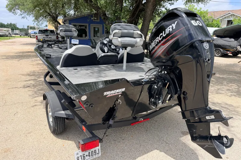 Slide: The Image of 2017 Tracker Pro Team 175 TXW boat with Mercury 60 engine, parked outdoors. - 9