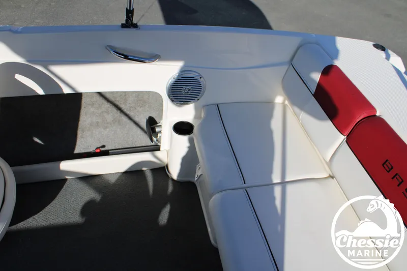 Slide: The Image of Interior of a 2015 Bayliner 170 boat with red and white seating. - 16