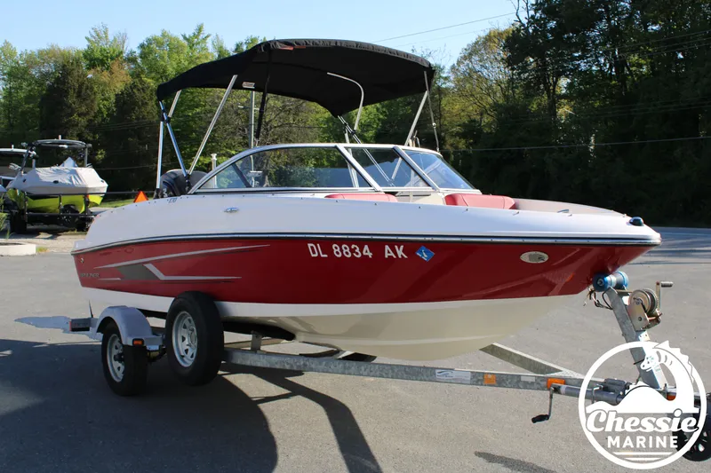 Slide: The Image of 2015 Bayliner 170 boat on trailer outdoors. - 7