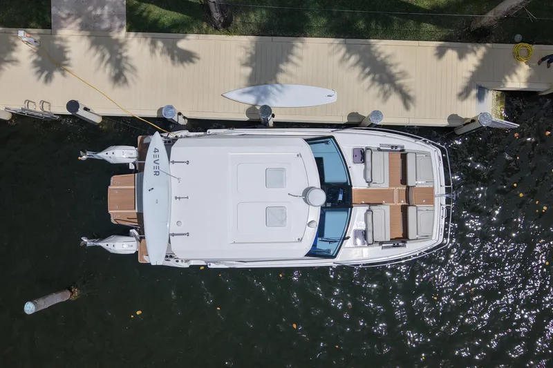 Slide: The Image of Overhead view of 2025 Aquila 36 Sport yacht docked by a wooden pier. - 12