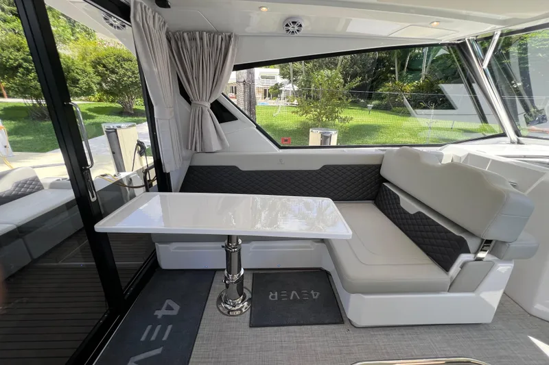Slide: The Image of Interior of 2025 Aquila 36 Sport yacht with seating and table. - 14