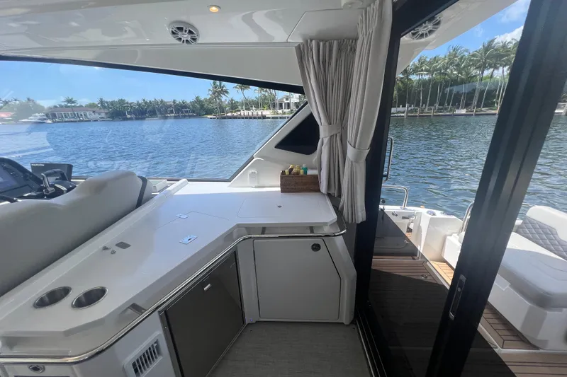 Slide: The Image of Interior view of 2025 Aquila 36 Sport yacht with sleek design and waterfront scenery. - 15