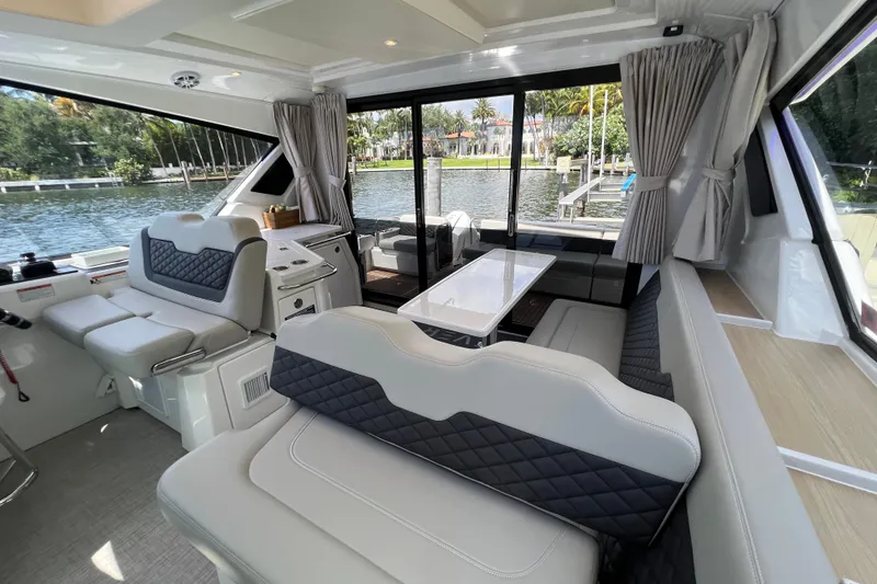 Slide: The Image of Luxurious interior of 2025 Aquila 36 Sport yacht with elegant seating and waterfront view. - 18