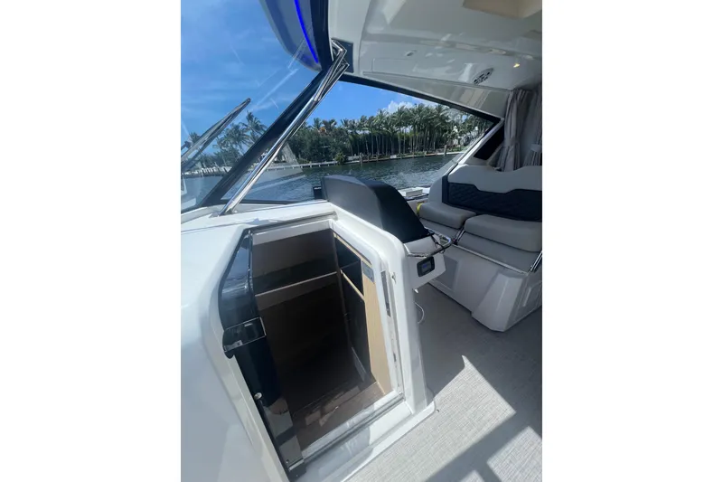 Slide: The Image of Interior view of 2025 Aquila 36 Sport yacht with open cabin door and seating. - 24