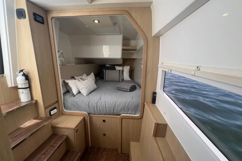 Slide: The Image of Interior cabin of 2025 Aquila 36 Sport yacht with cozy bed and ocean view. - 25