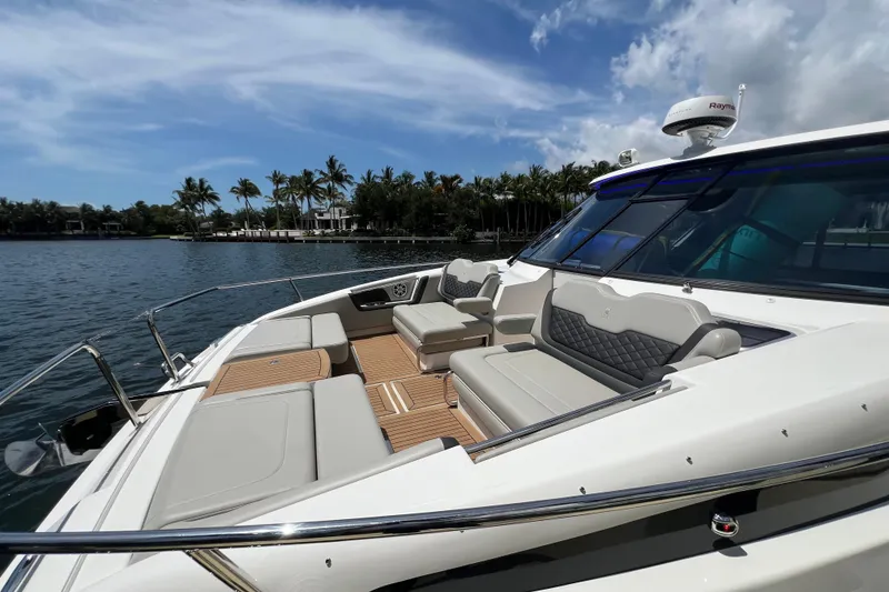 Slide: The Image of 2025 Aquila 36 Sport yacht with luxurious seating, cruising on a sunny day. - 32