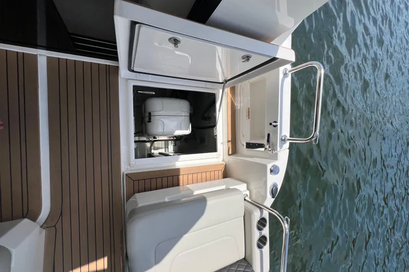 Slide: The Image of Aquila 36 Sport 2025 boat with open storage compartment on deck. - 34
