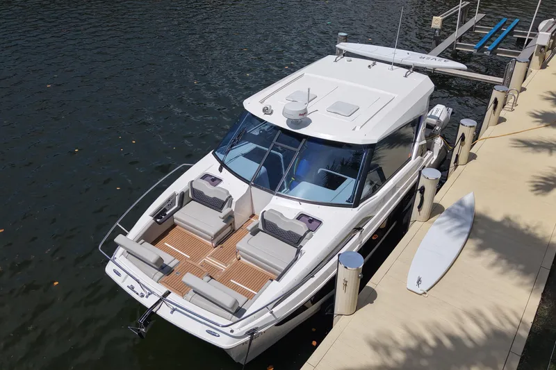 Slide: The Image of Aquila 36 Sport 2025 docked, showcasing sleek design and spacious seating. - 5
