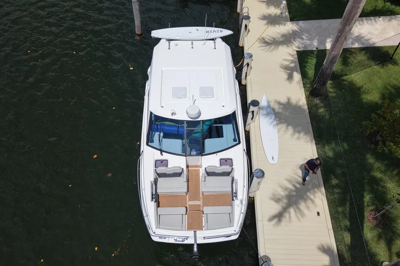 Slide: The Image of Aerial view of 2025 Aquila 36 Sport yacht docked by a wooden pier. - 9