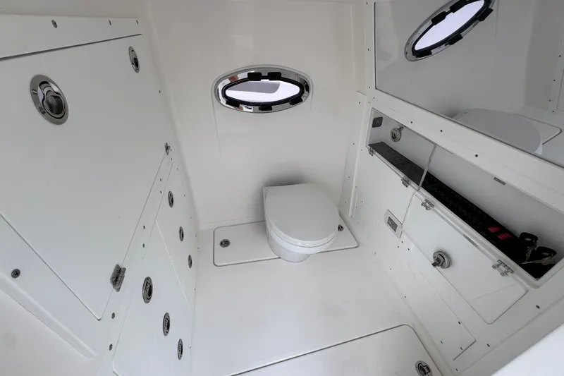 Slide: The Image of 2026 Caymas 34 CT boat interior bathroom with modern fixtures and porthole window. - 25