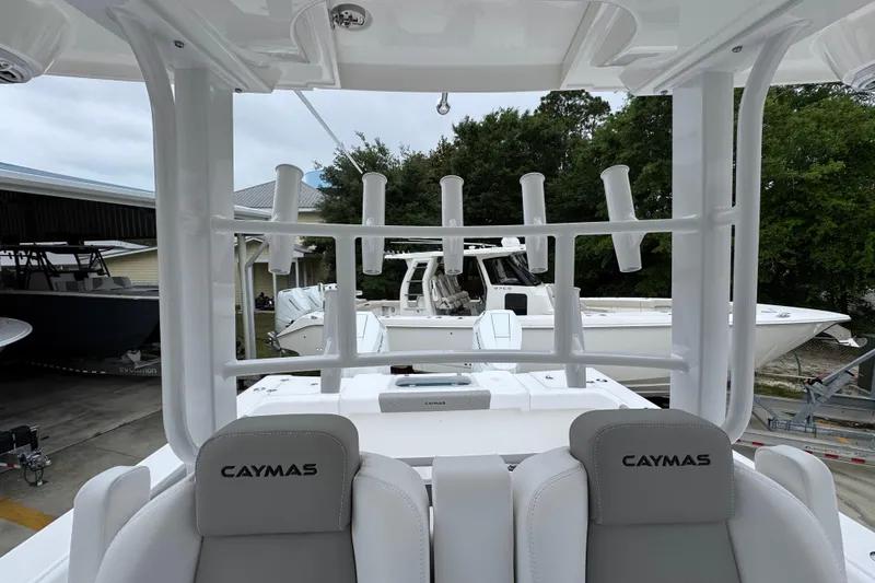 Slide: The Image of 2026 Caymas 34 CT boat interior with rod holders and seating. - 28