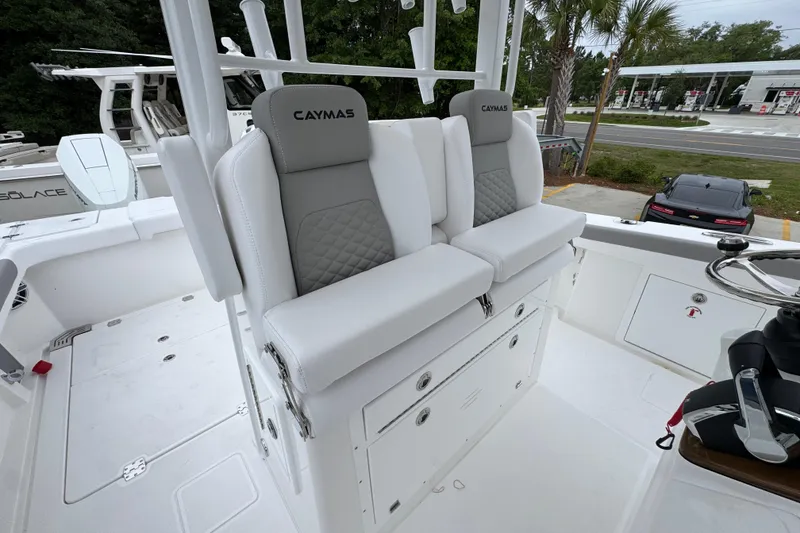 Slide: The Image of 2026 Caymas 34 CT boat interior with cushioned seating and steering wheel. - 29