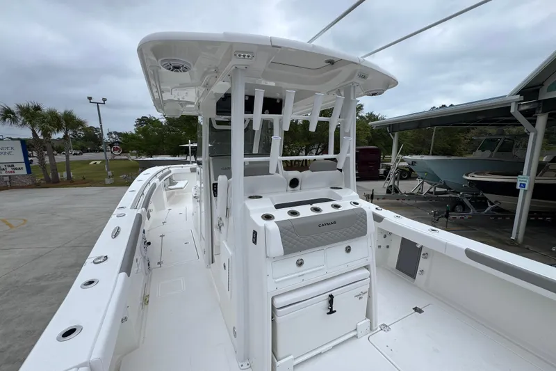 Slide: The Image of 2026 Caymas 34 CT boat with spacious deck and modern design in a marina setting. - 34