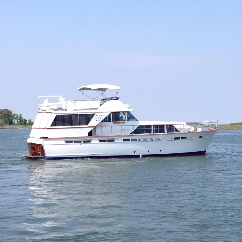 The Image of 1971 Chris-Craft 57 Constellation yacht on calm waters. - 0