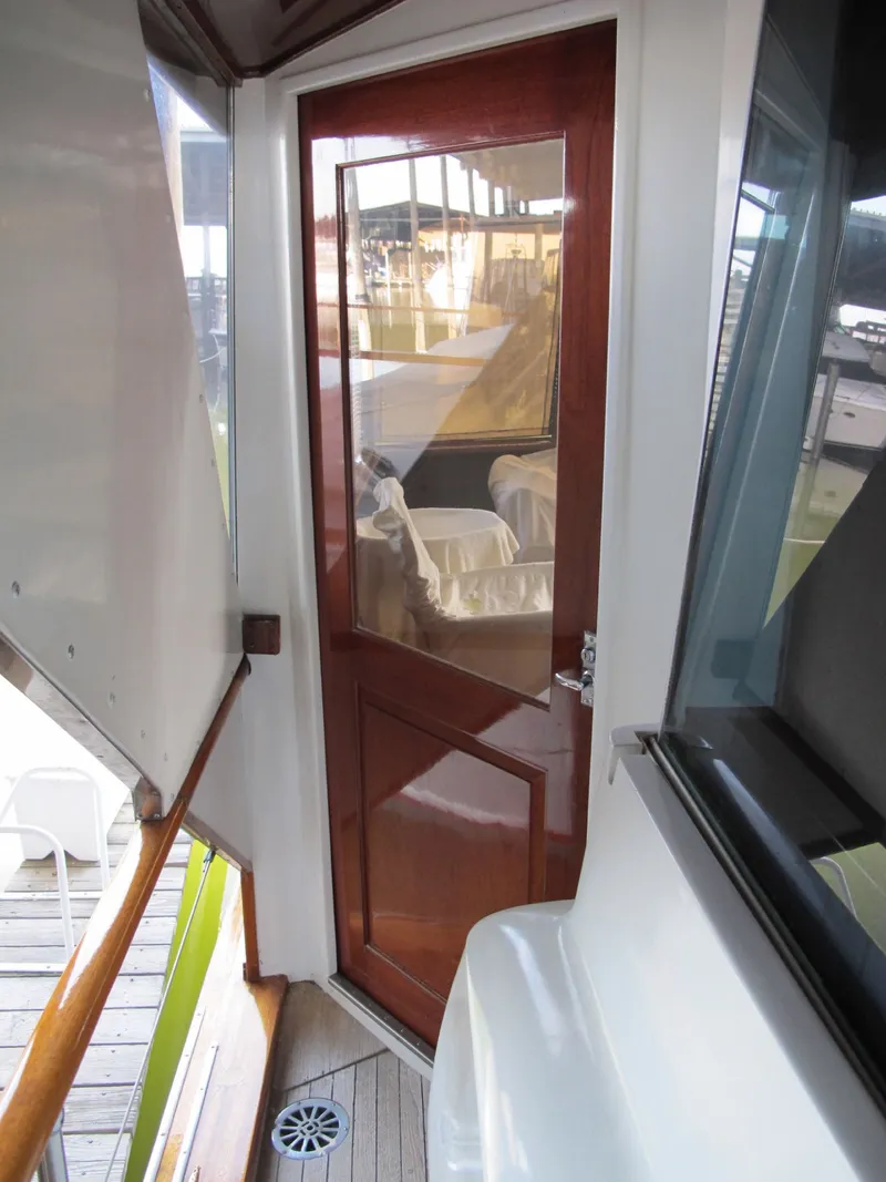 Slide: The Image of Wooden door on 1971 Chris-Craft 57 Constellation yacht. - 11