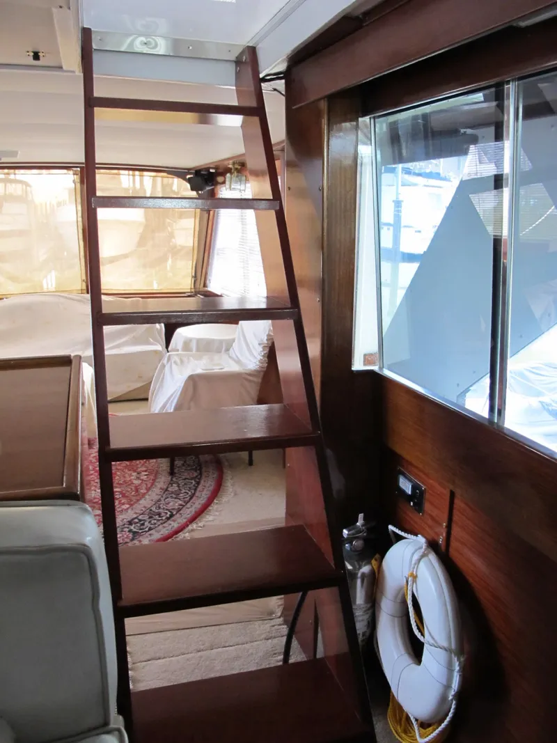 Slide: The Image of Interior of 1971 Chris-Craft 57 Constellation yacht with wooden stairs. - 19