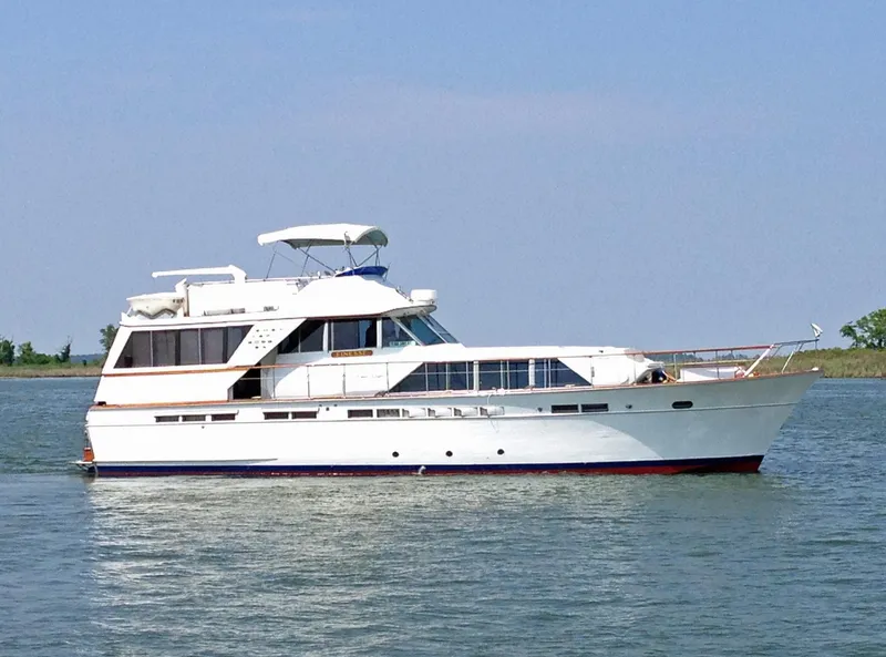 Slide: The Image of 1971 Chris-Craft 57 Constellation yacht on calm water. - 2