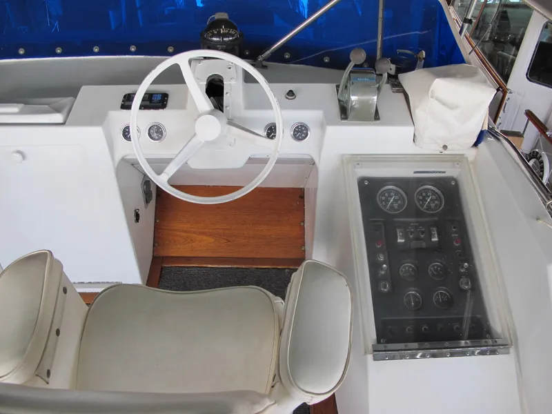 Slide: The Image of Interior view of 1971 Chris-Craft 57 Constellation helm with white seating. - 21
