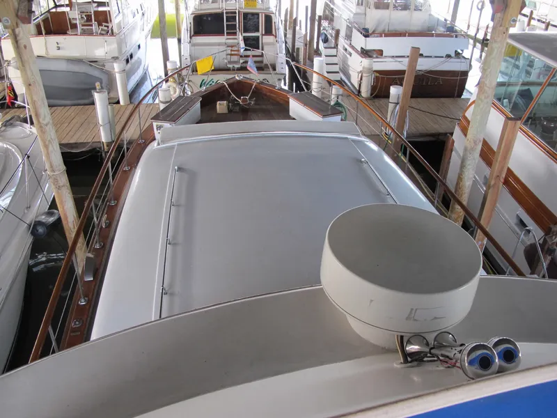 Slide: The Image of 1971 Chris-Craft 57 Constellation docked in a marina. - 26