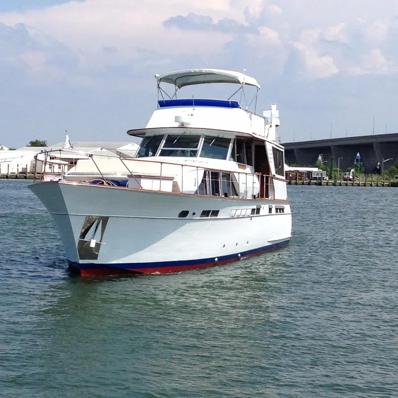 Slide: The Image of 1971 Chris-Craft 57 Constellation yacht on calm waters. - 4