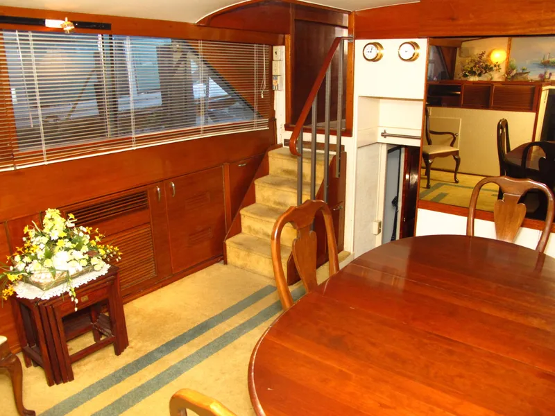 Slide: The Image of Interior of 1971 Chris-Craft 57 Constellation yacht with wooden furniture and stairs. - 42
