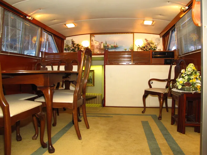 Slide: The Image of Interior of 1971 Chris-Craft 57 Constellation yacht with elegant wooden furnishings. - 44