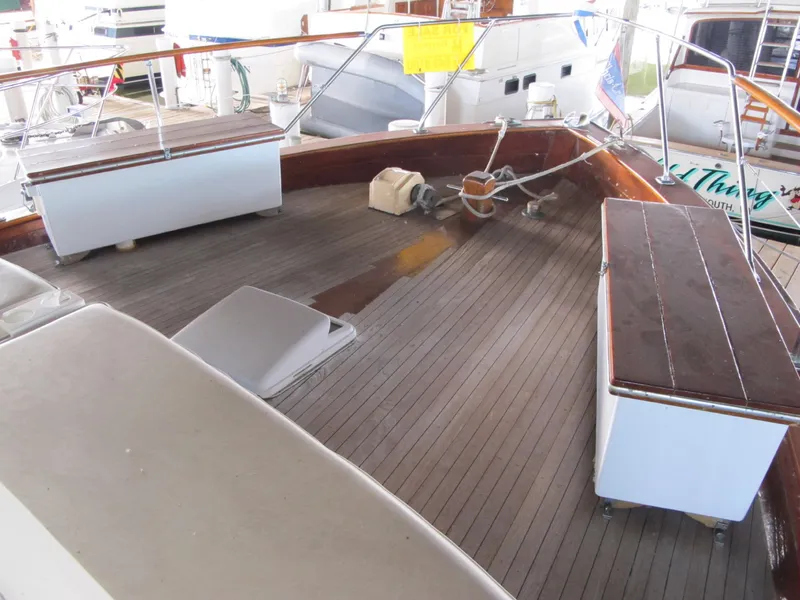 Slide: The Image of 1971 Chris-Craft 57 Constellation deck with wooden benches. - 8